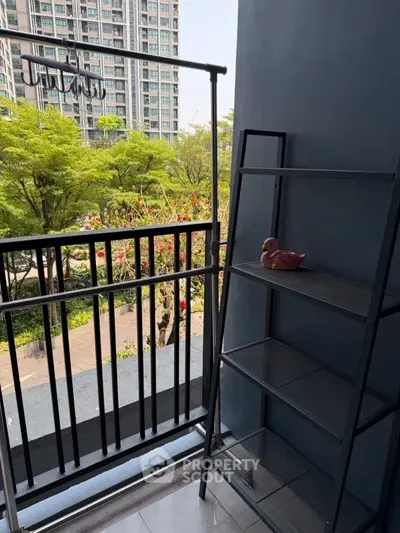 Charming balcony with lush garden view and modern shelving unit.