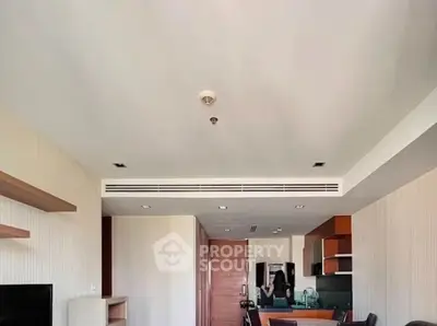 Modern open-plan living room with stylish kitchen and dining area