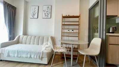 Modern living room with cozy sofa and dining area in stylish apartment