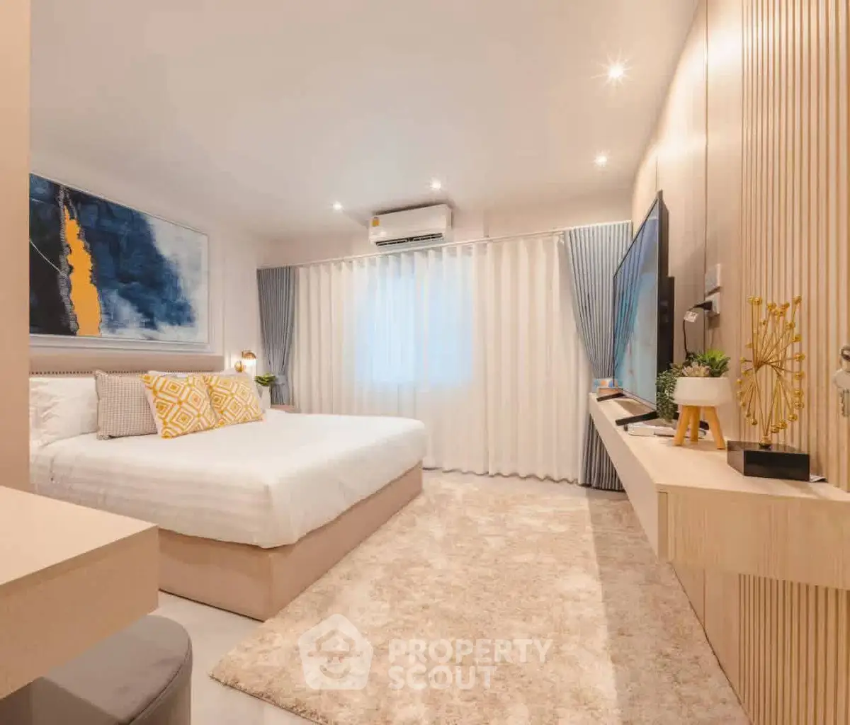 Luxurious modern bedroom with stylish decor and ambient lighting