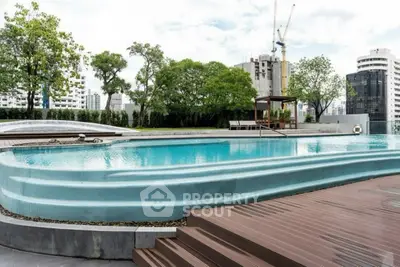 Luxurious rooftop pool with city skyline views and modern design.