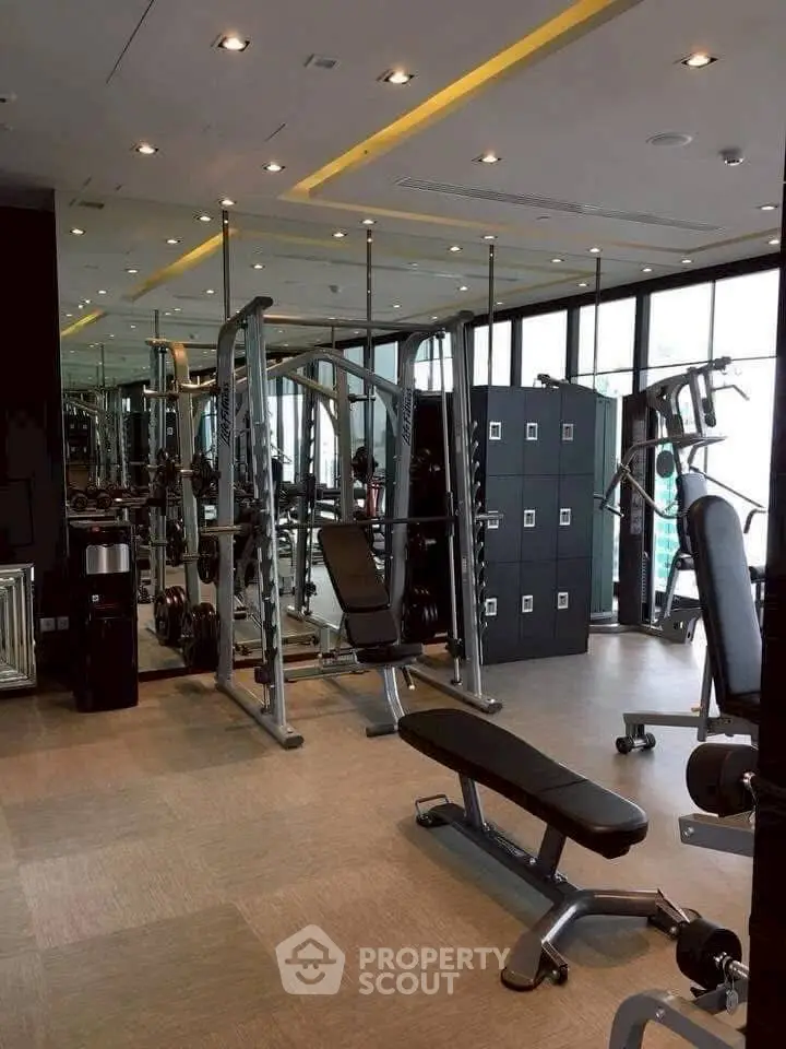 Modern gym with state-of-the-art equipment and floor-to-ceiling windows.