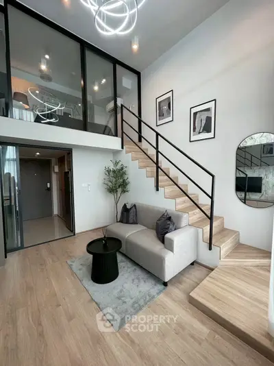 Modern duplex living room with stylish decor and mezzanine level