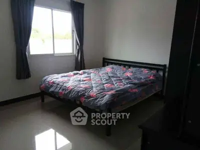 Cozy bedroom with natural light and simple decor