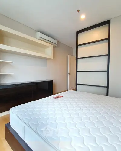 Spacious bedroom with modern design and ample storage space