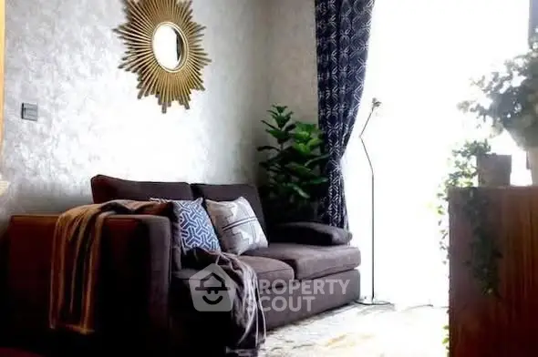 Stylish living room with modern decor and cozy seating area.