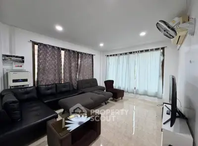 Spacious living room with modern furniture and natural light