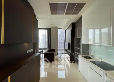 Luxurious modern apartment with sleek kitchen and spacious living area, offering stunning city views.