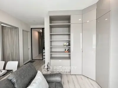 Modern living room with sleek built-in shelving and neutral decor