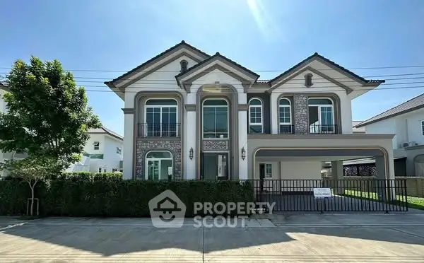 Elegant two-story house with classic design and spacious driveway in a serene neighborhood.