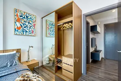 Modern bedroom with stylish wardrobe and artistic decor