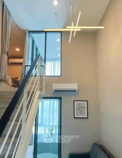 Modern loft apartment with high ceilings and stylish lighting