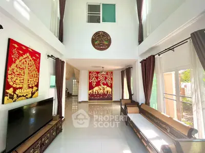 Spacious living room with high ceilings and elegant decor