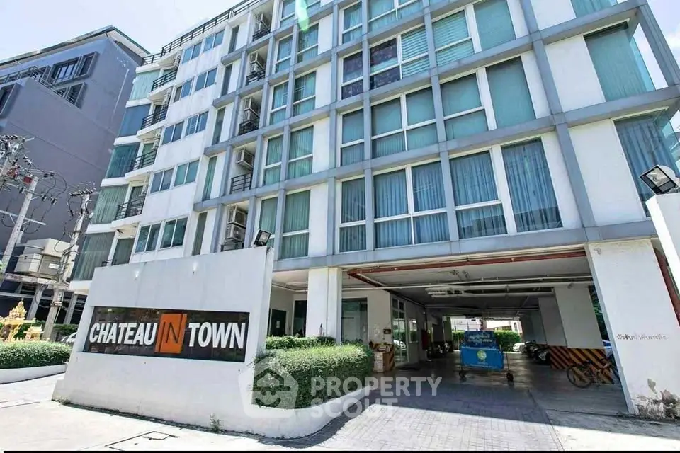 Modern urban apartment building with spacious entrance and contemporary design.