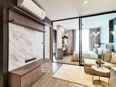 Modern open-plan living room with stylish decor and natural light