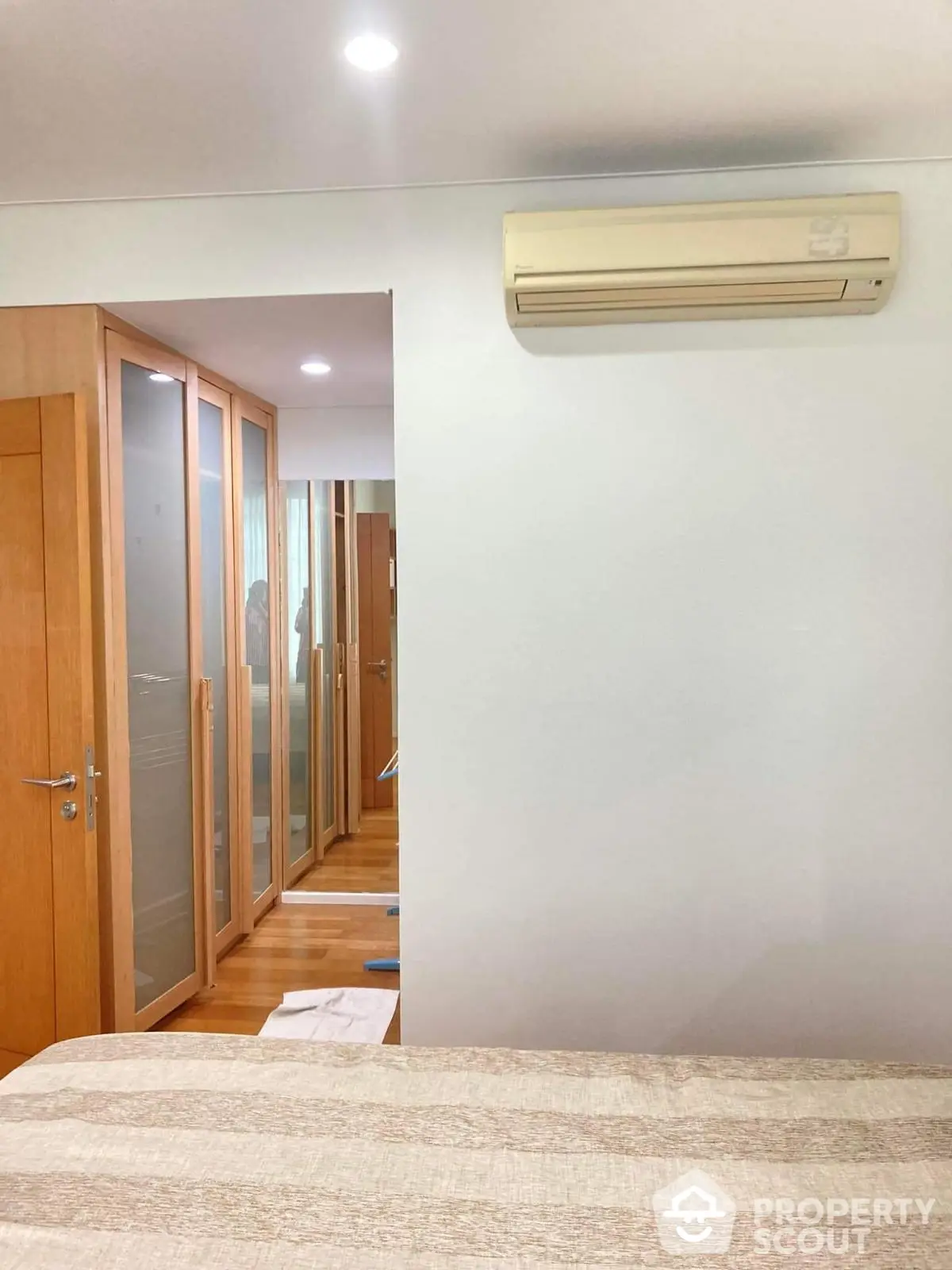 Spacious bedroom with built-in wardrobe and air conditioning