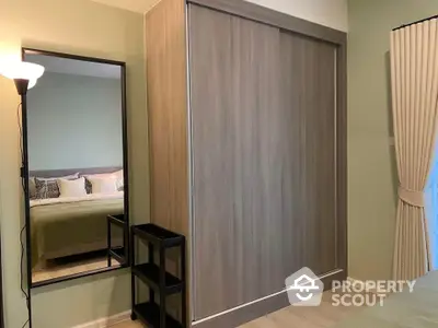 Cozy bedroom with sliding wardrobe and elegant decor