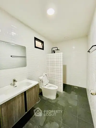 Spacious modern bathroom with sleek fixtures and minimalist design