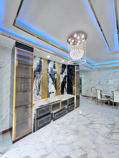 Luxurious modern interior with marble flooring and elegant chandelier