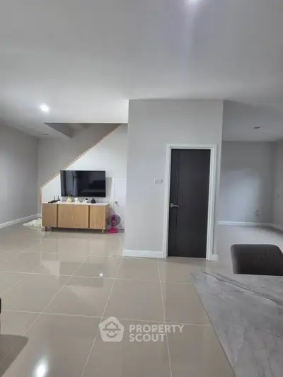 Modern living room with sleek TV setup and minimalist design