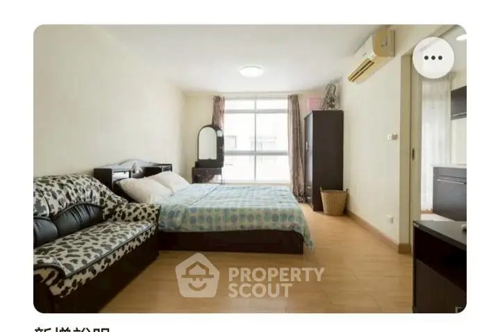 Spacious bedroom with modern decor and natural light