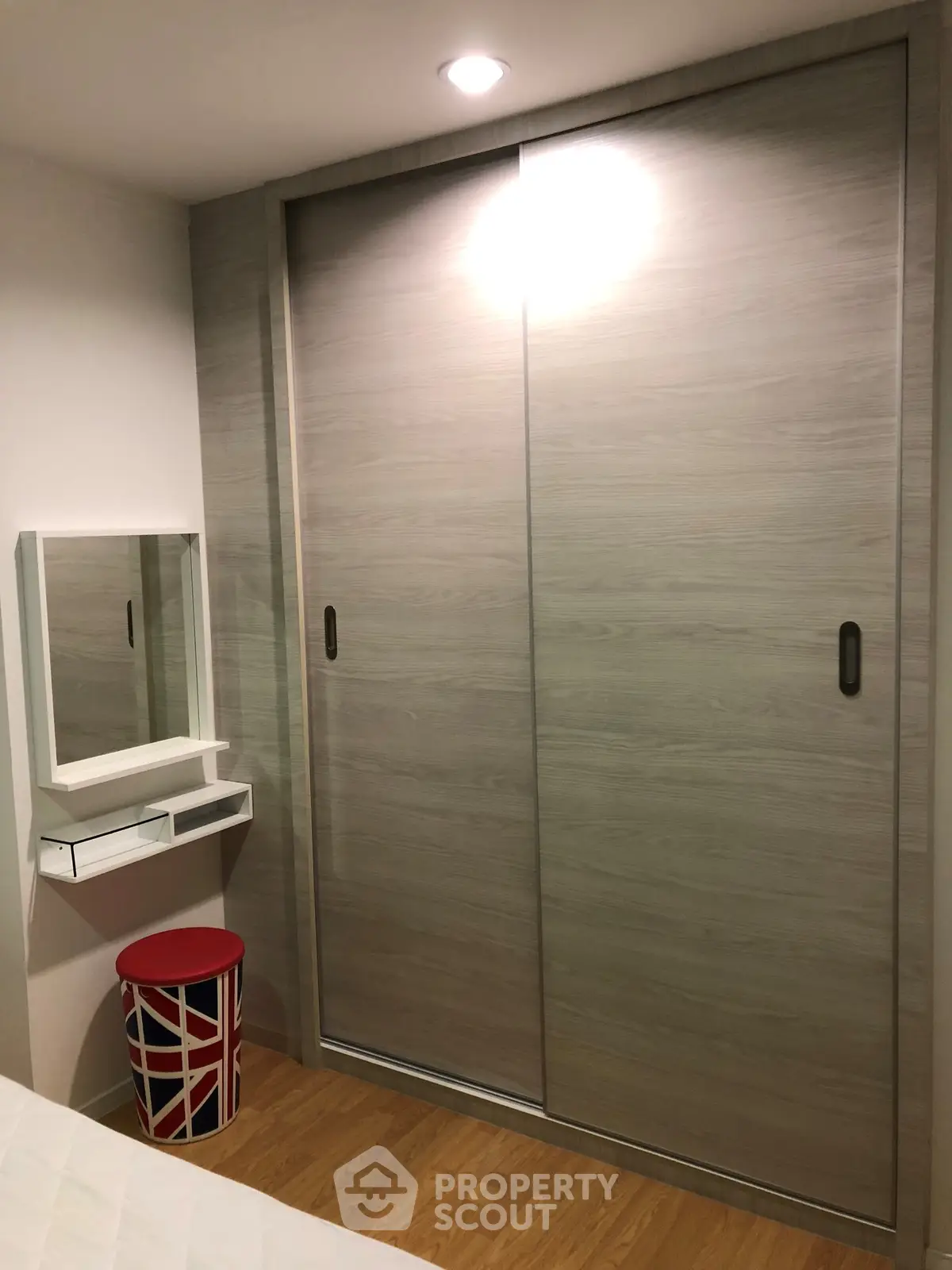 Modern bedroom with sliding closet doors and stylish decor