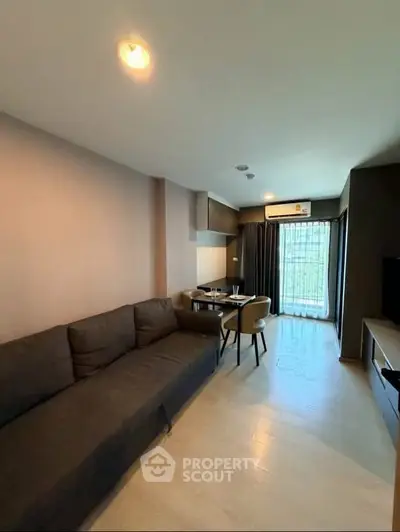 Modern living room with sleek furniture and natural light, perfect for urban living.