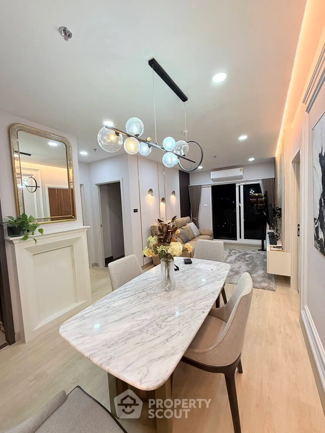 Stylish modern living room with elegant dining area and chic lighting