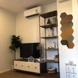 Modern living room with stylish shelving and wall decor