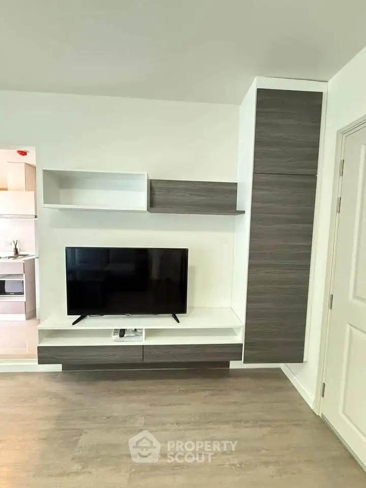 Modern living room with sleek TV unit and stylish shelving