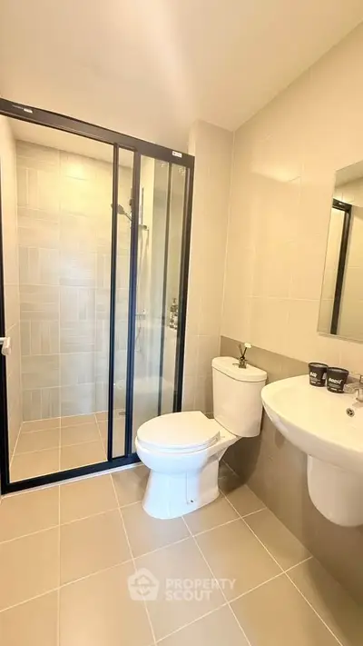 Modern bathroom with sleek shower enclosure and elegant fixtures