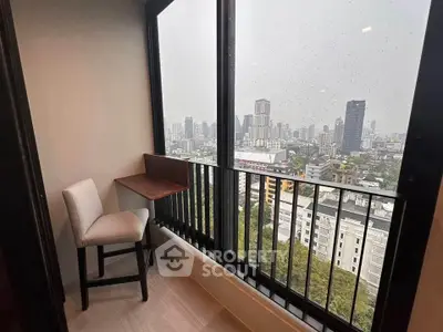 Cozy balcony with city view, perfect for relaxation and enjoying the skyline.