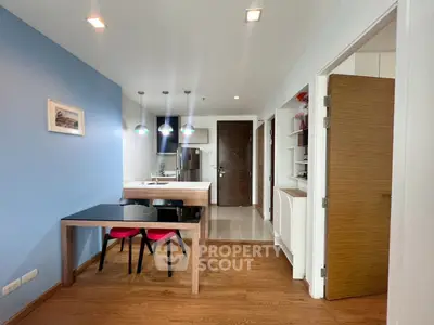 Modern kitchen with open layout and stylish dining area in a contemporary apartment.