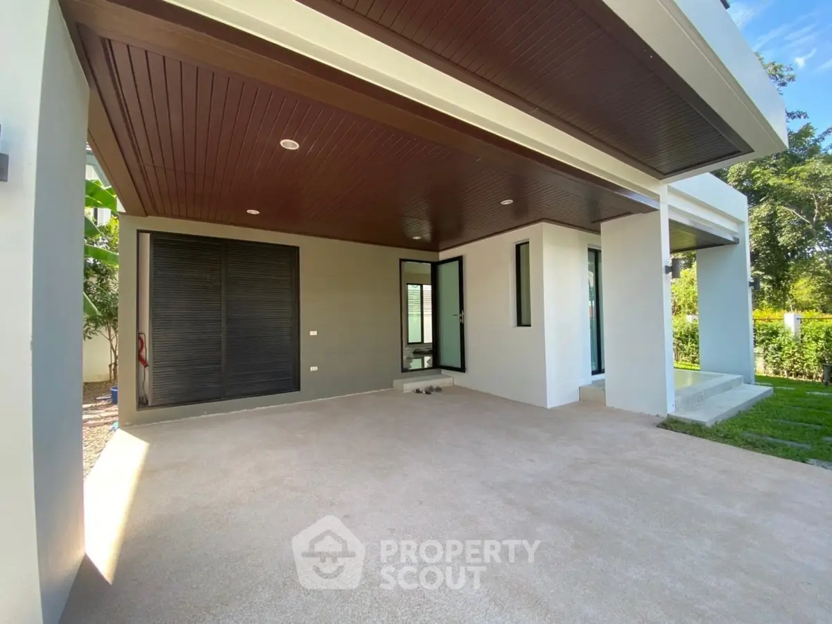 Modern home exterior with spacious covered patio and sleek design