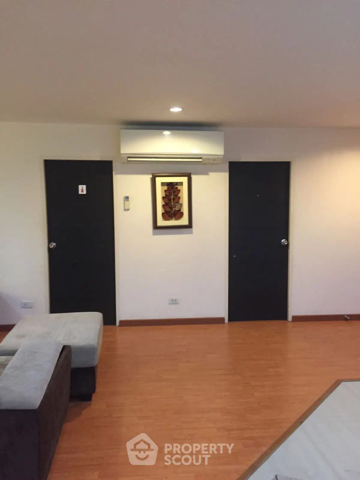 Modern living room with wooden flooring and stylish decor
