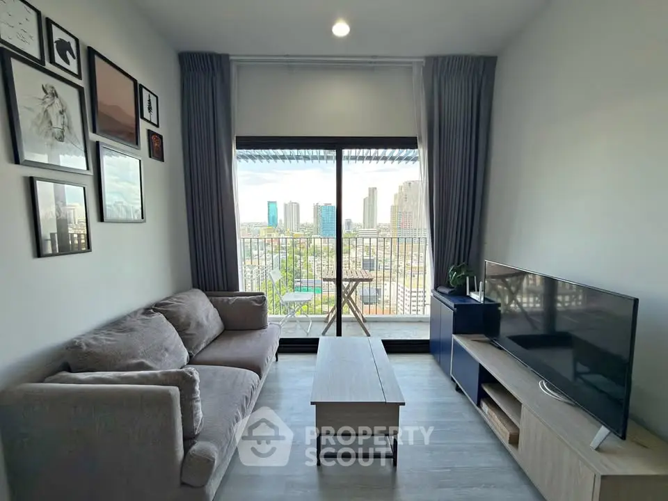 Modern living room with city view, cozy sofa, and stylish decor in a high-rise apartment.