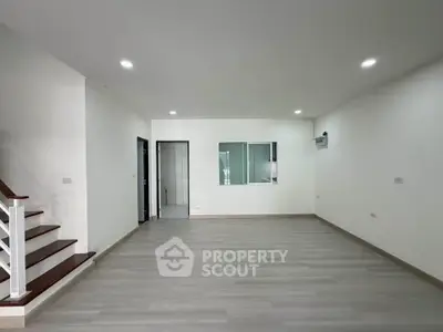 Spacious modern living room with sleek flooring and minimalist design