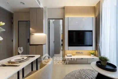 Modern living room with stylish decor and wall-mounted TV, perfect for urban living.