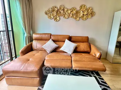 Luxurious living room with stylish leather sofa and modern decor, perfect for urban living.