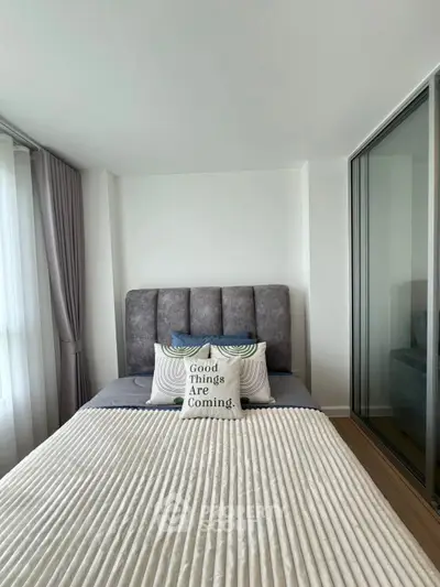 Cozy modern bedroom with stylish decor and natural light