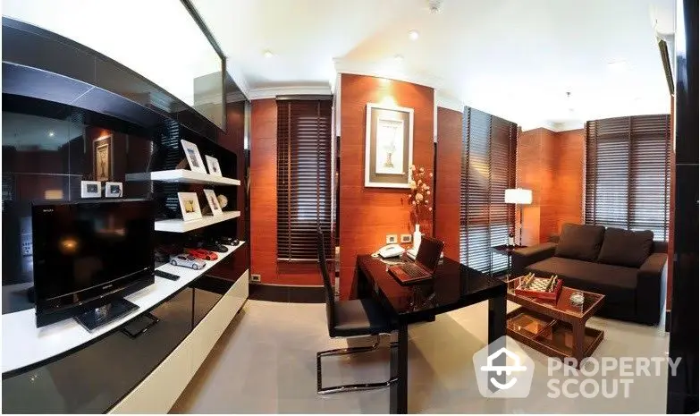 Elegant living room with modern furnishings, sleek black entertainment unit, and warm wooden blinds creating a cozy atmosphere.