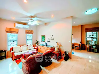 Charming living room with cozy wicker furniture and warm lighting, perfect for relaxation and entertaining.