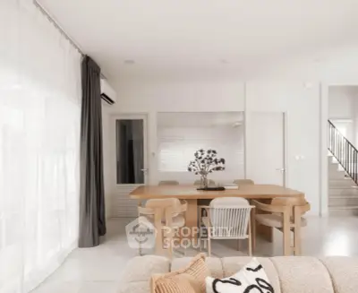 Elegant modern living room with stylish dining area and neutral decor