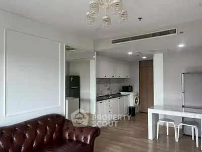Elegant open-layout kitchen with modern appliances and stylish living area