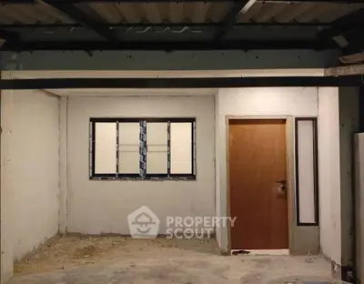 Unfinished interior space with window and door, potential for customization