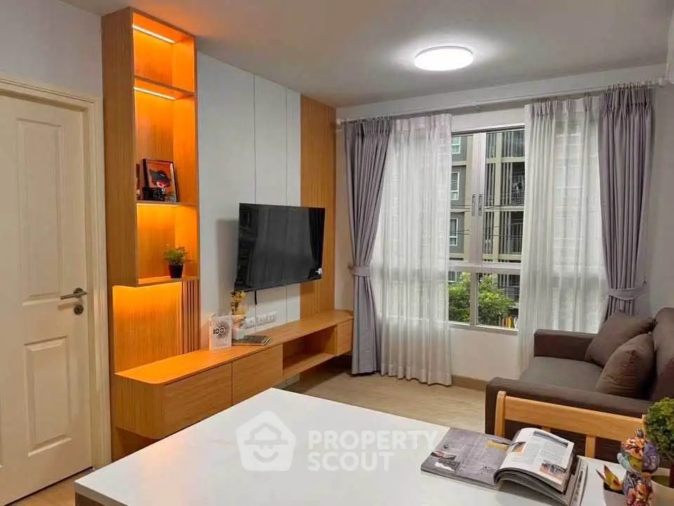 Modern living room with stylish decor and large window view