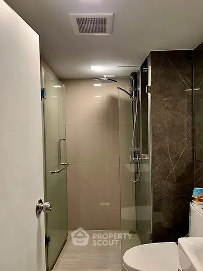 Modern bathroom with glass shower and sleek design