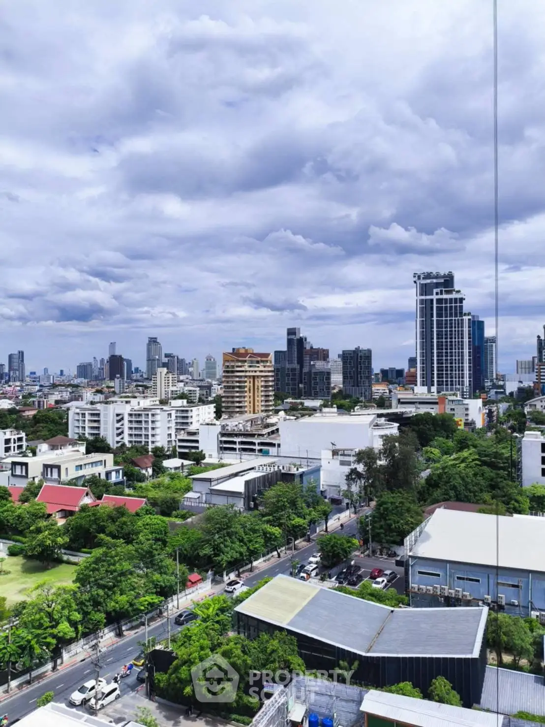 Stunning cityscape view showcasing modern skyline and lush greenery, perfect for urban living enthusiasts.