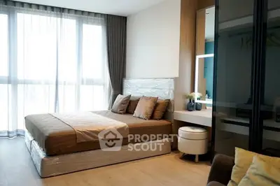 Modern bedroom with large window and stylish decor