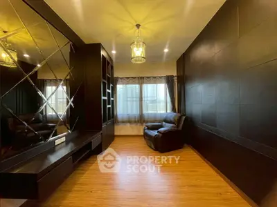 Luxurious living room with elegant dark wood paneling and cozy seating